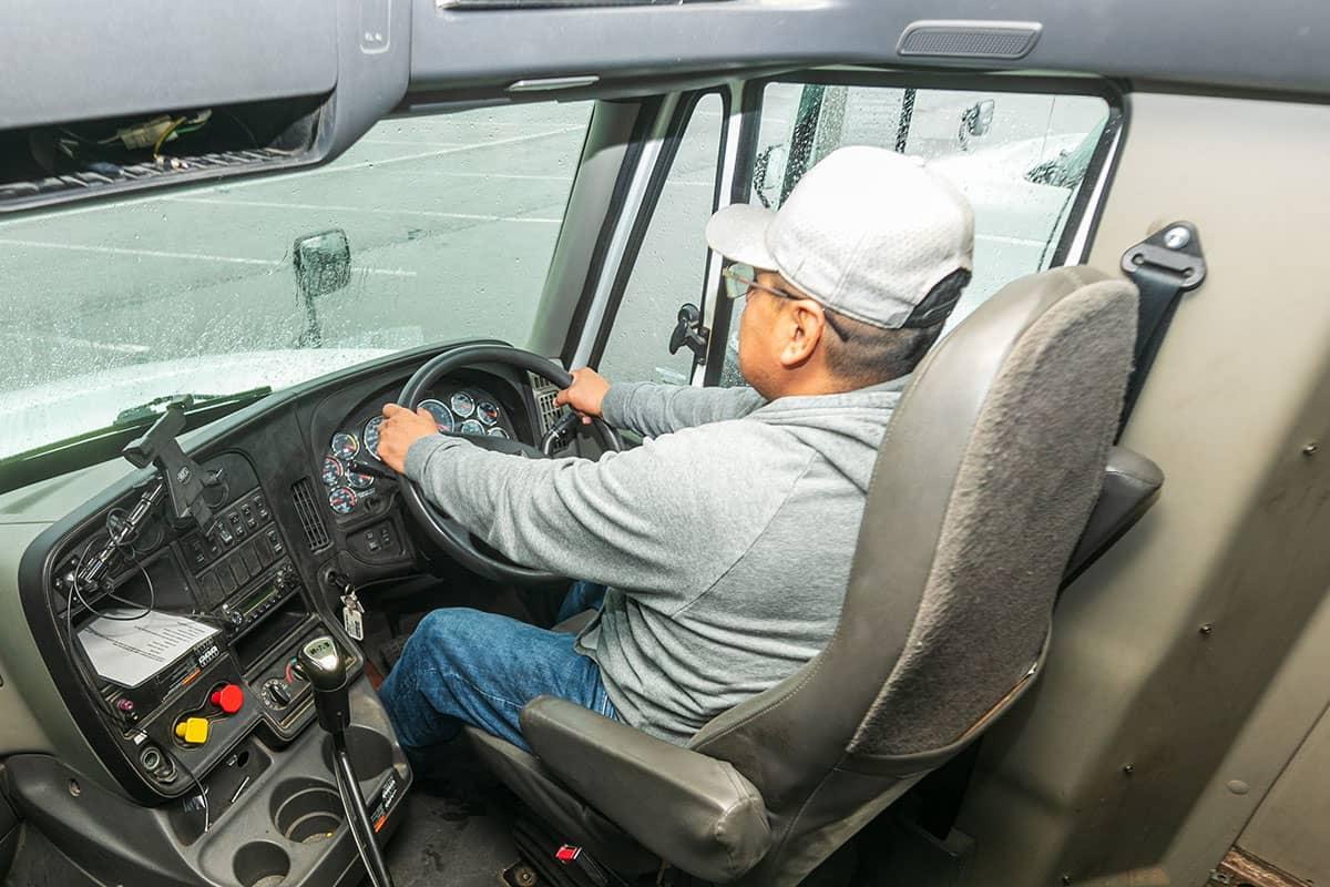 A San Juan College student in the cab of a large commercial truck