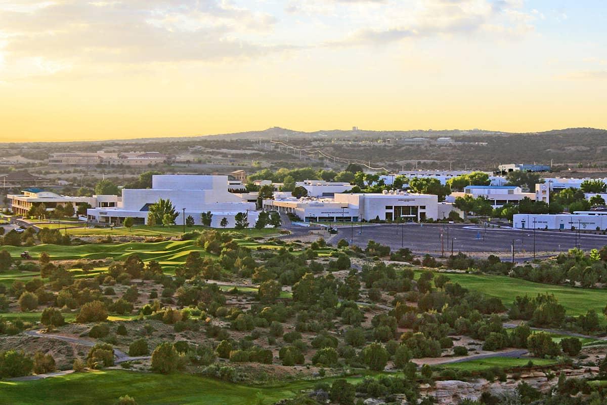 scenic view of the farmington campus with the morning sun rising behind the campus.